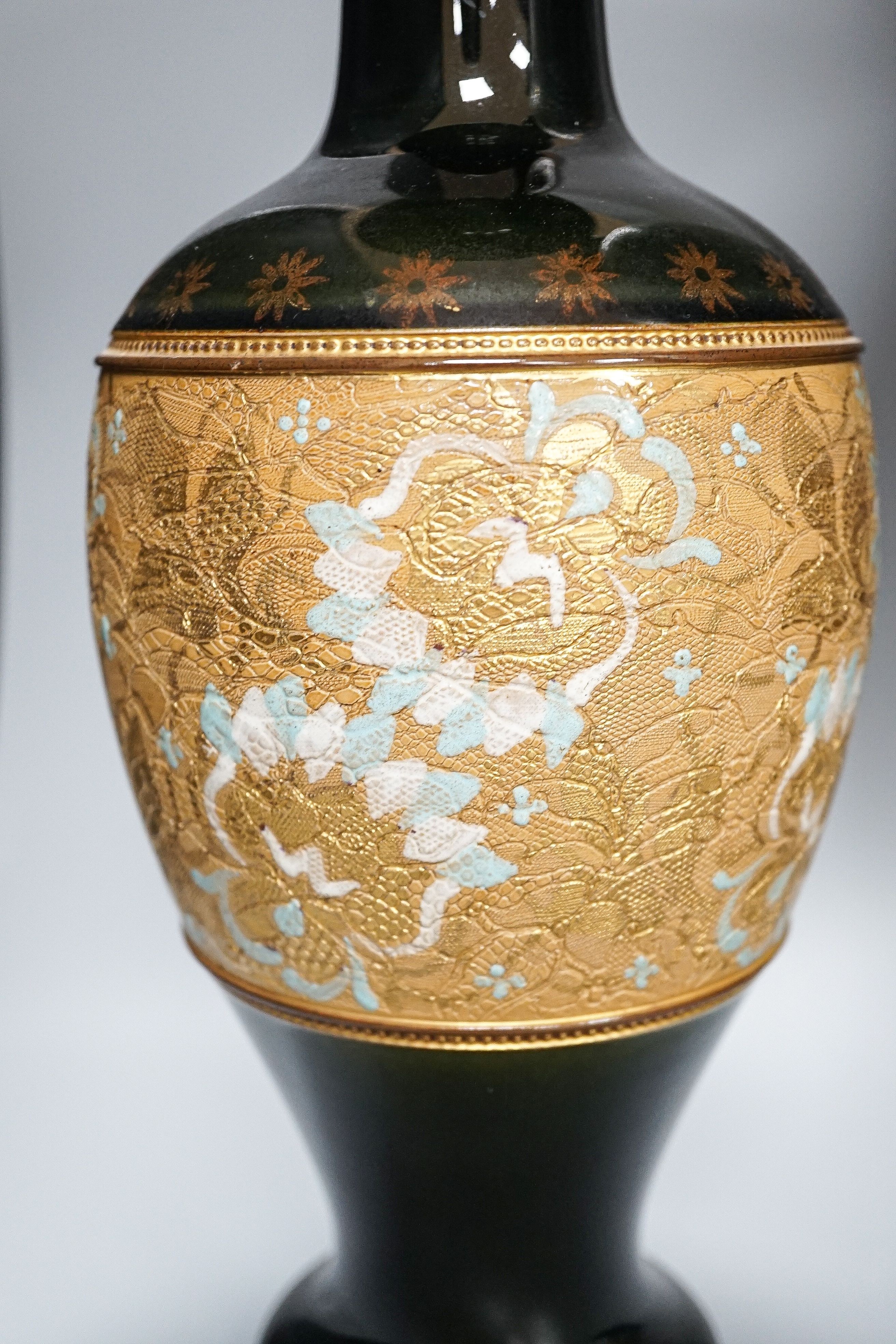 A large Doulton Slater's Patent vase, 46cm and a pair of similar smaller vases, 34cm